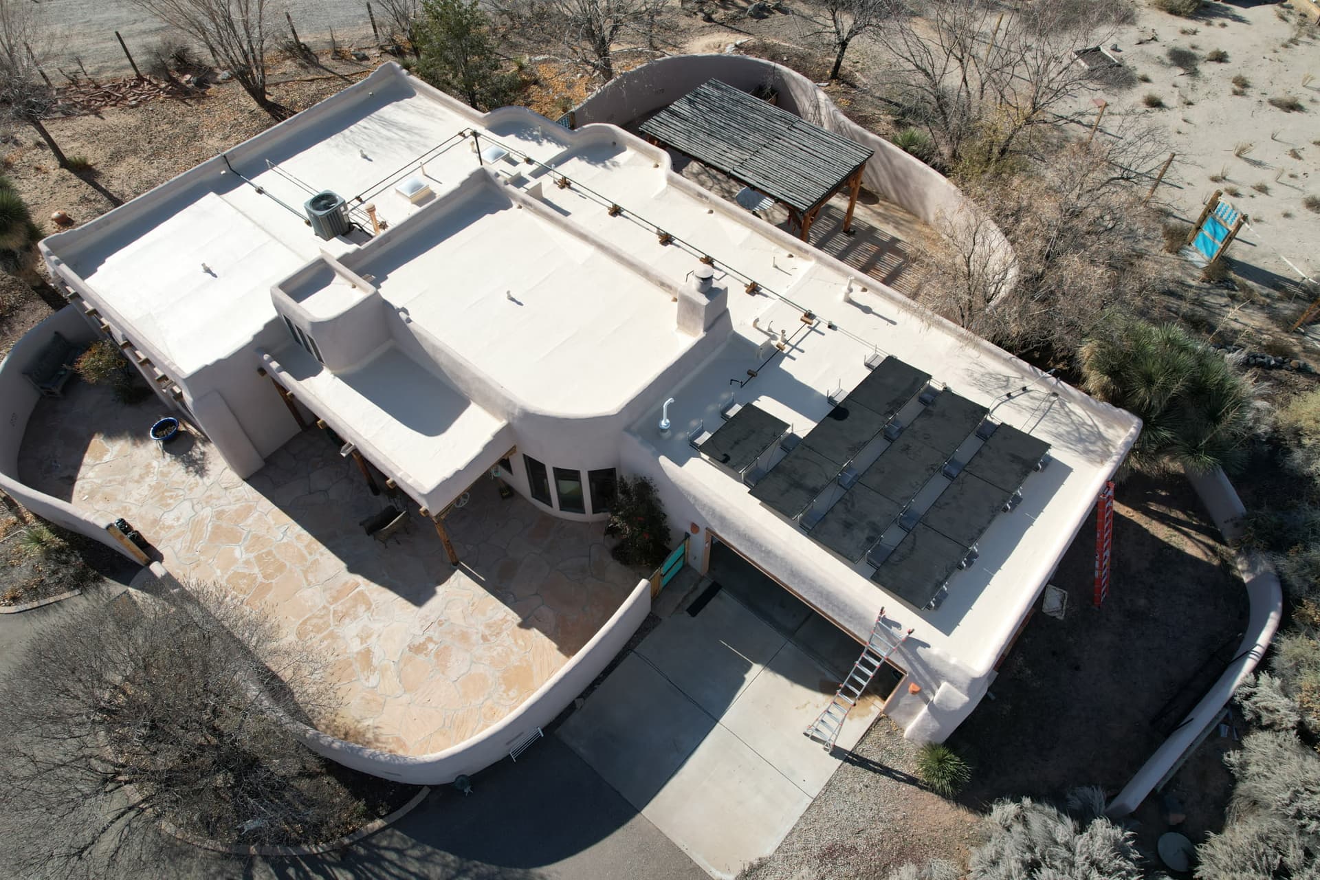 Roof replacement with solar panels reinstalled by Lobo Roofs